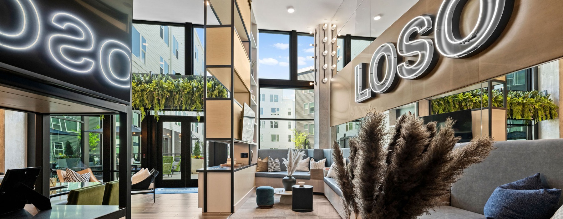 Close up of LoSo sign and sofa in resident lounge